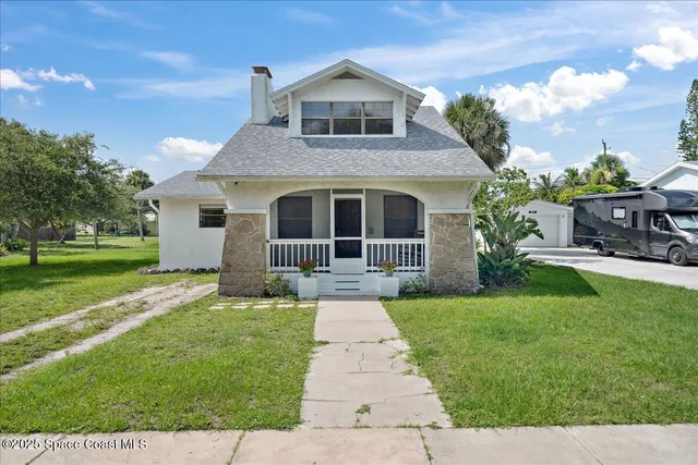 a house view with a garden space