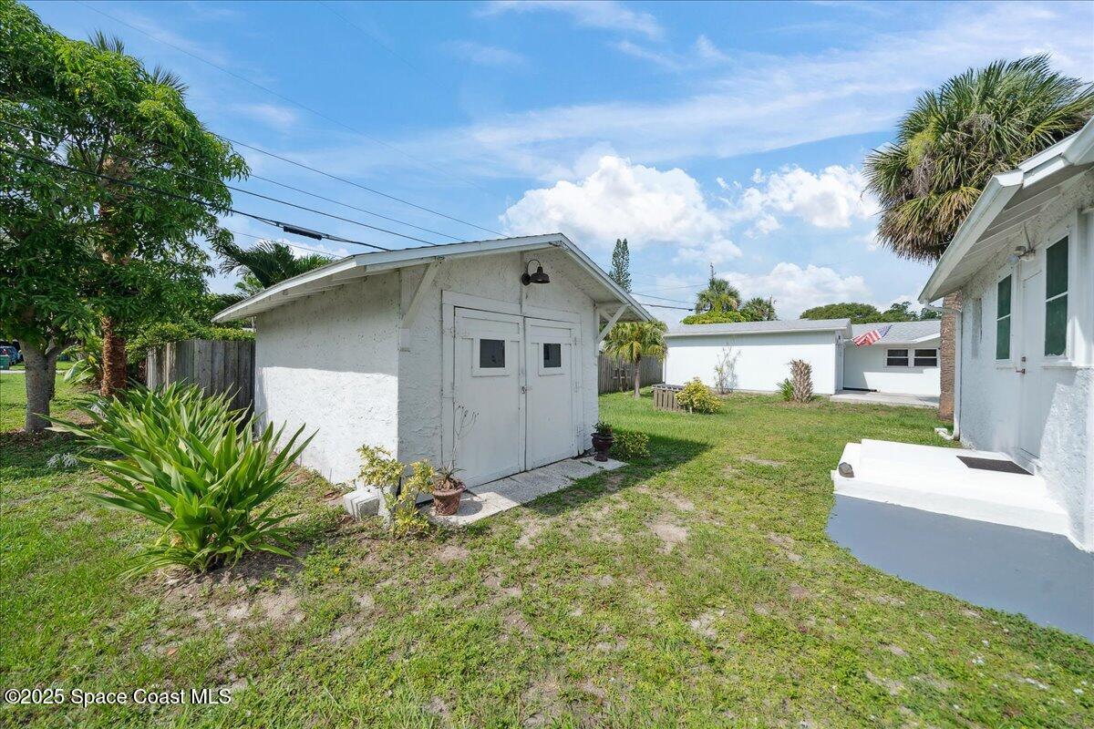 415 2nd Avenue Indialantic, FL 32903 - Photo 42 of 51 a front view of a house with garden