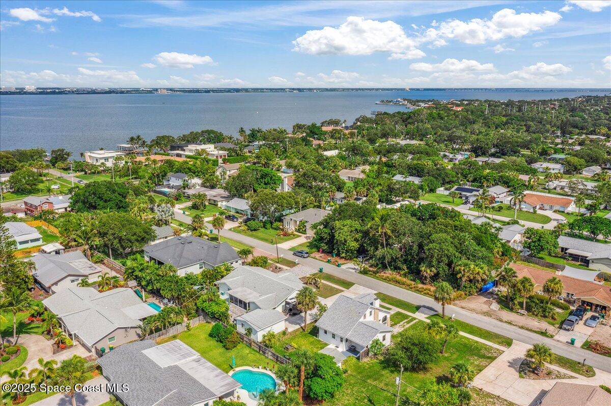 415 2nd Avenue Indialantic, FL 32903 - Photo 48 of 51 an aerial view of a city with lots of residential buildings ocean and mountain view in back