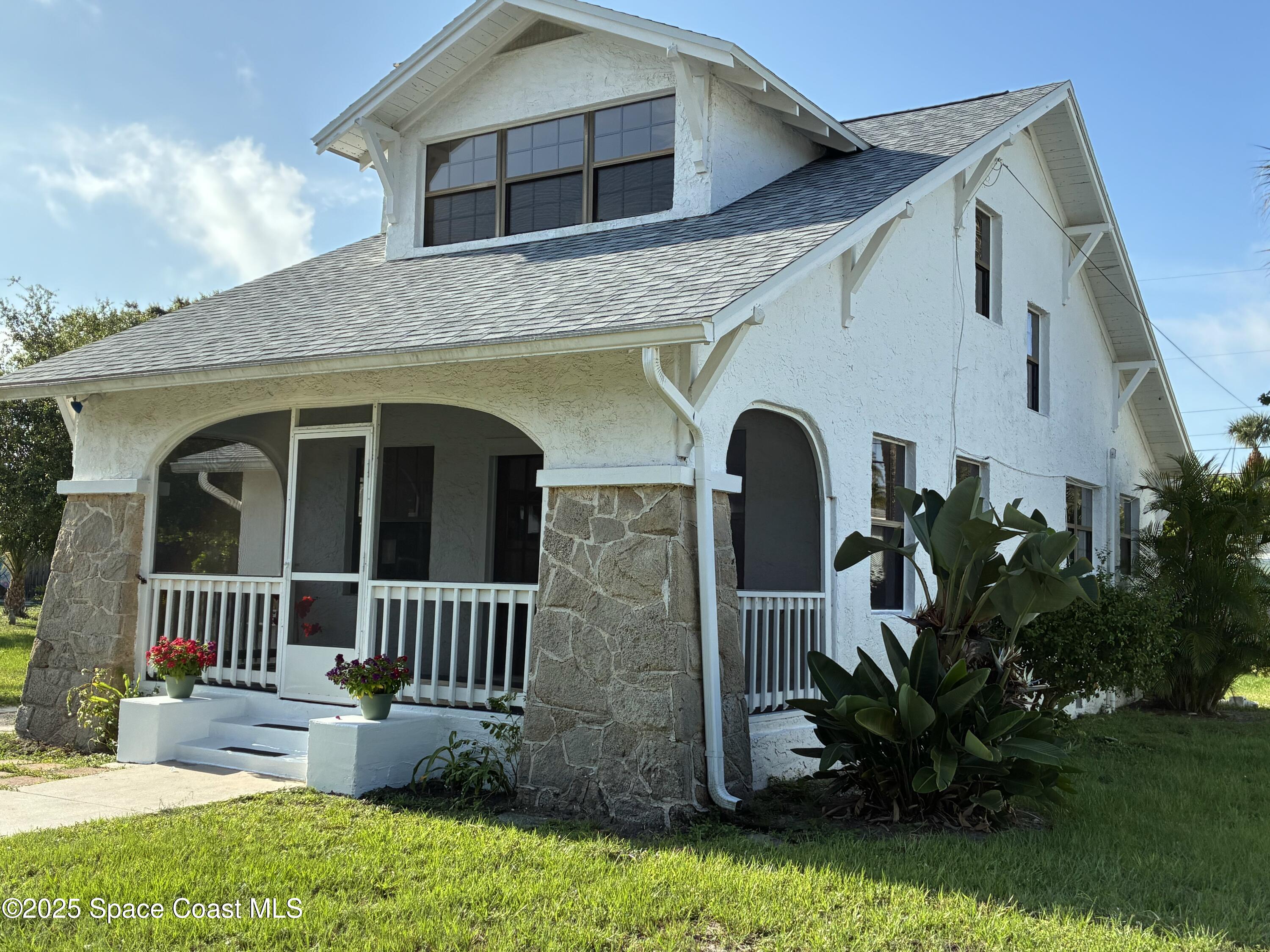 415 2nd Avenue Indialantic, FL 32903 - Photo 51 of 51 a front view of a house with garden