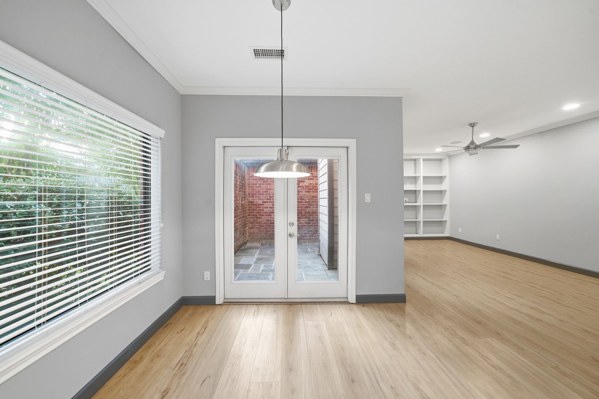 7447 Cambridge Street, Unit 65 Houston, TX 77054 - Photo 15 of 42 a view of a room with wooden floor and a window