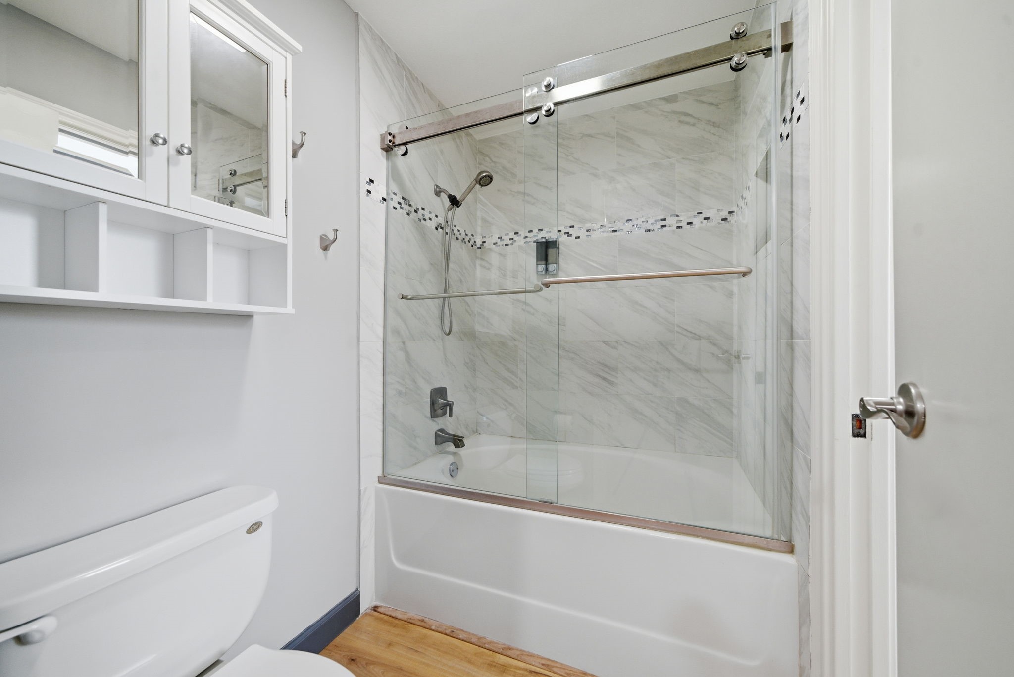 7447 Cambridge Street, Unit 65 Houston, TX 77054 - Photo 23 of 42 a bathroom with a shower and a toilet