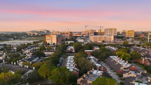 a view of a city with tall buildings