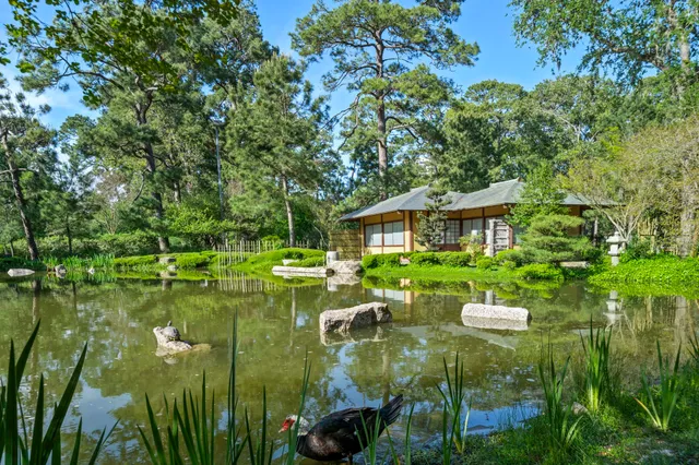 a picture of a bathroom with a shower