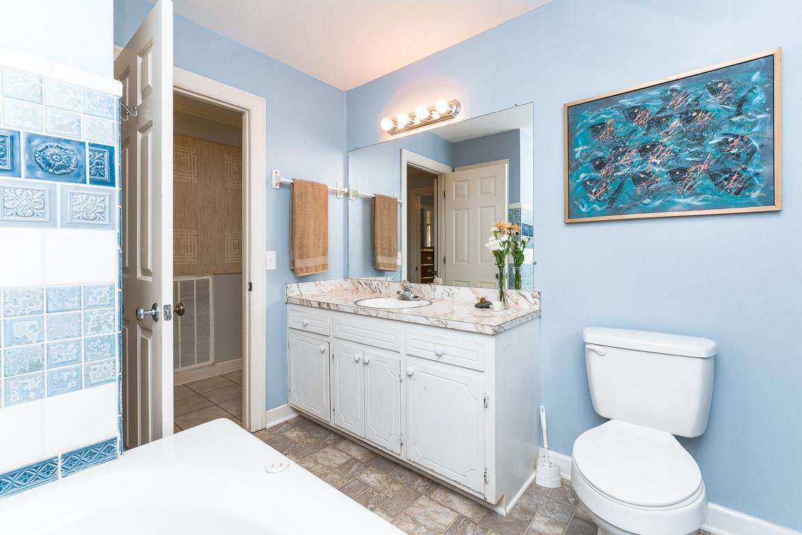 528 Georgetown Road Clarksville, TN 37043 - Photo 11 of 30 a spacious bathroom with a toilet a sink and a large mirror