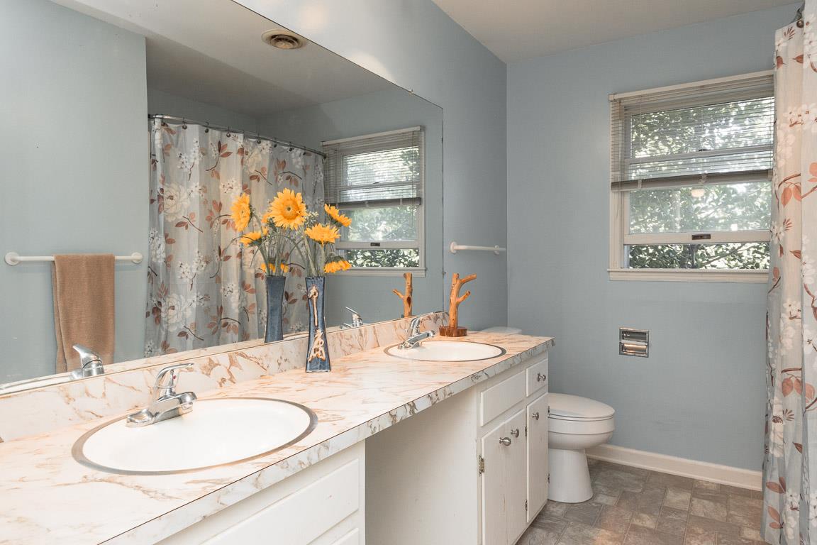 528 Georgetown Road Clarksville, TN 37043 - Photo 14 of 30 a bathroom with a double vanity sink toilet and a mirror