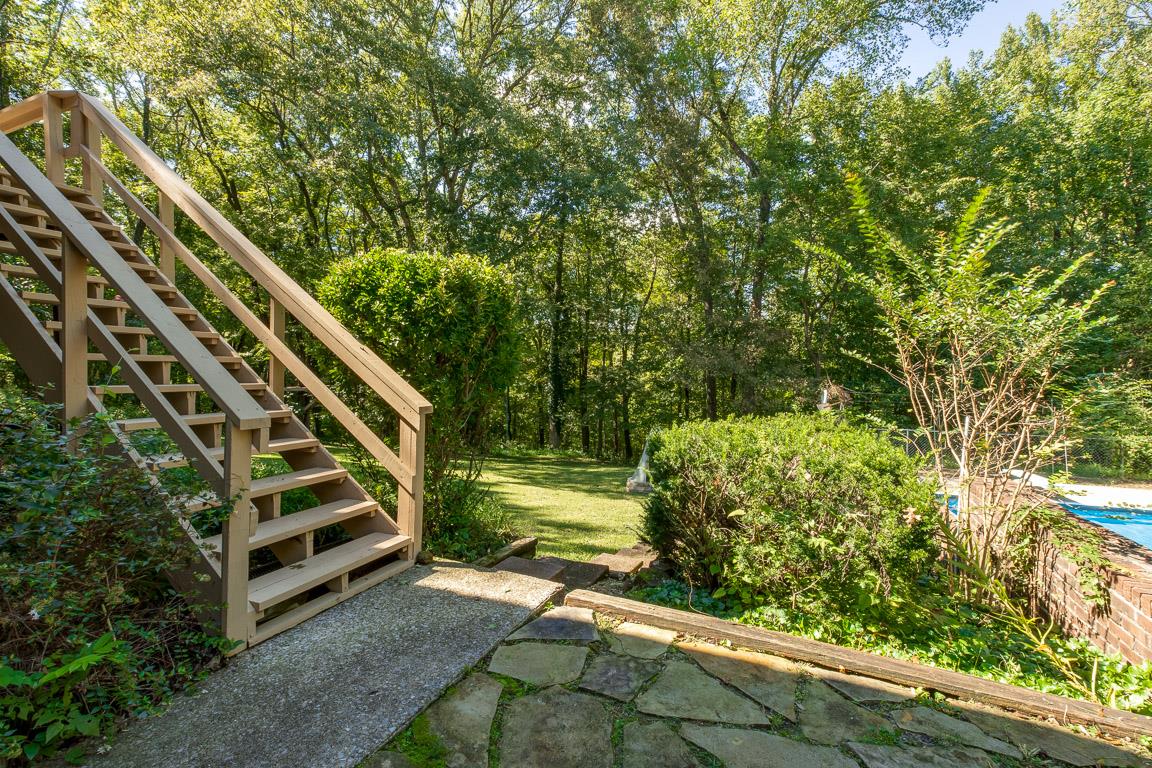 528 Georgetown Road Clarksville, TN 37043 - Photo 24 of 30 a view of a yard with plants and a bench