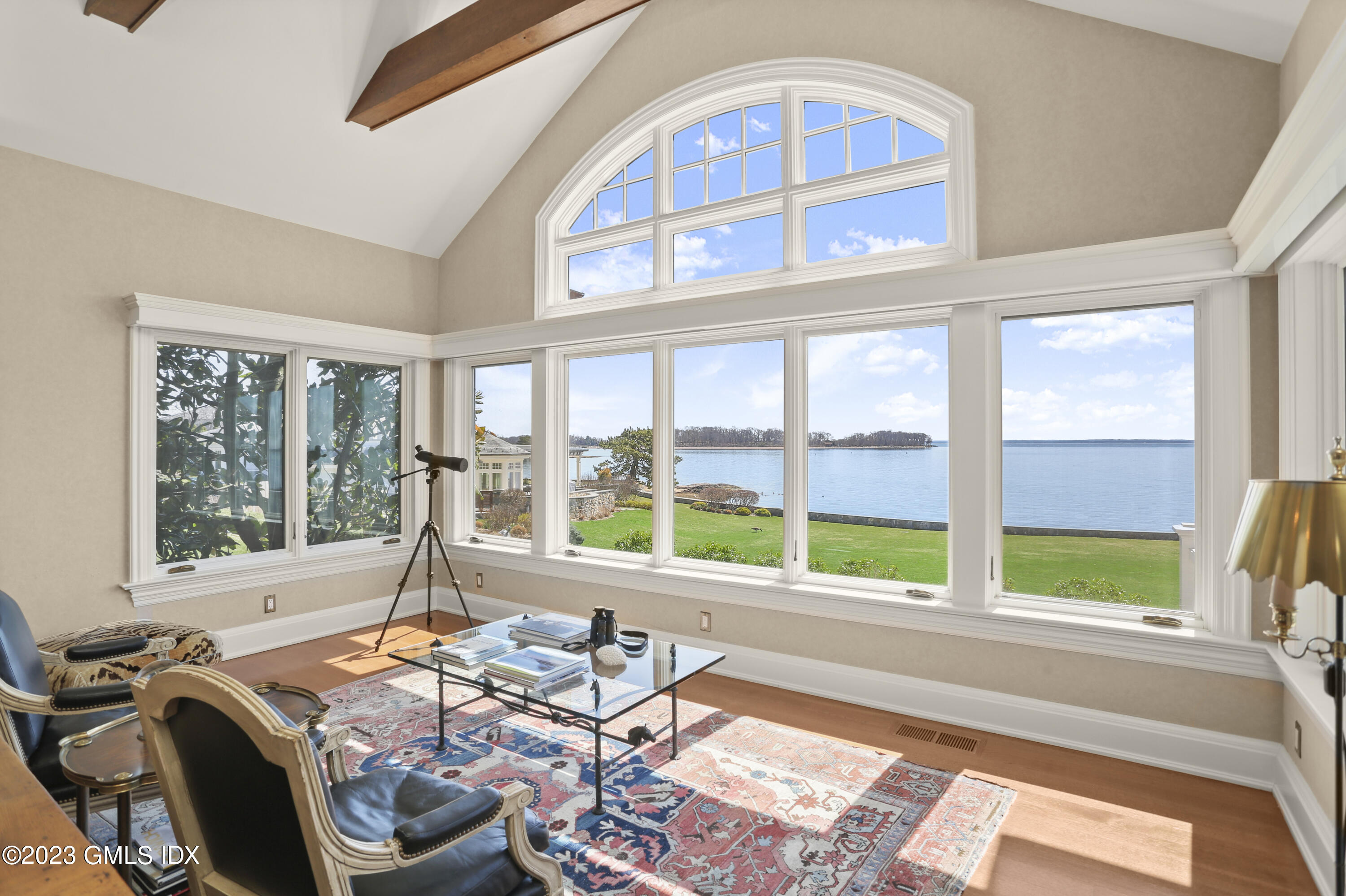 18 Pilot Rock Lane Riverside, CT 06878 - Photo 17 of 50 a living room filled with furniture and floor to ceiling windows