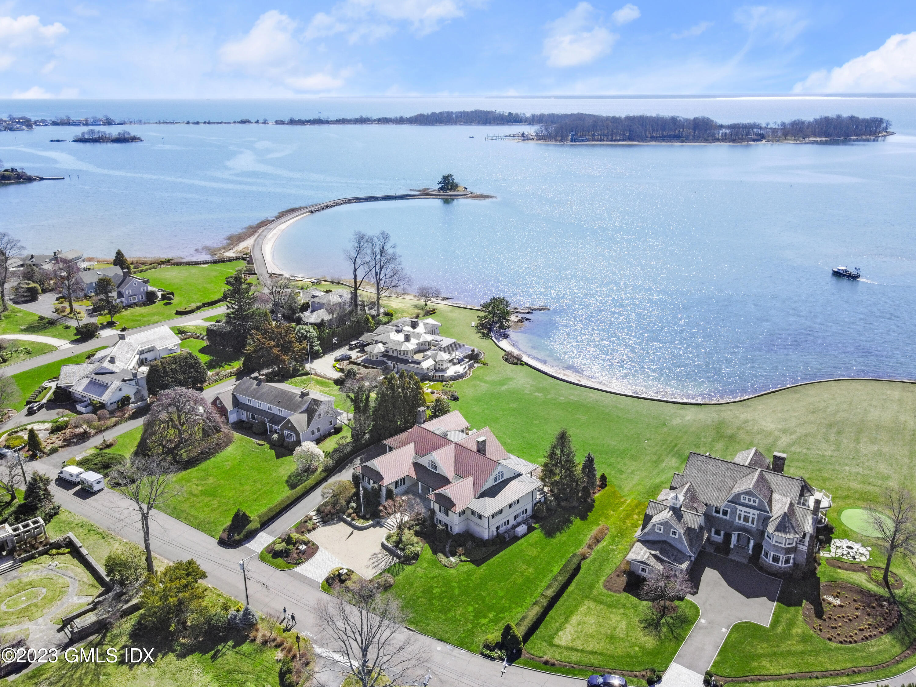 18 Pilot Rock Lane Riverside, CT 06878 - Photo 2 of 50 a aerial view of a house with a garden and lake view