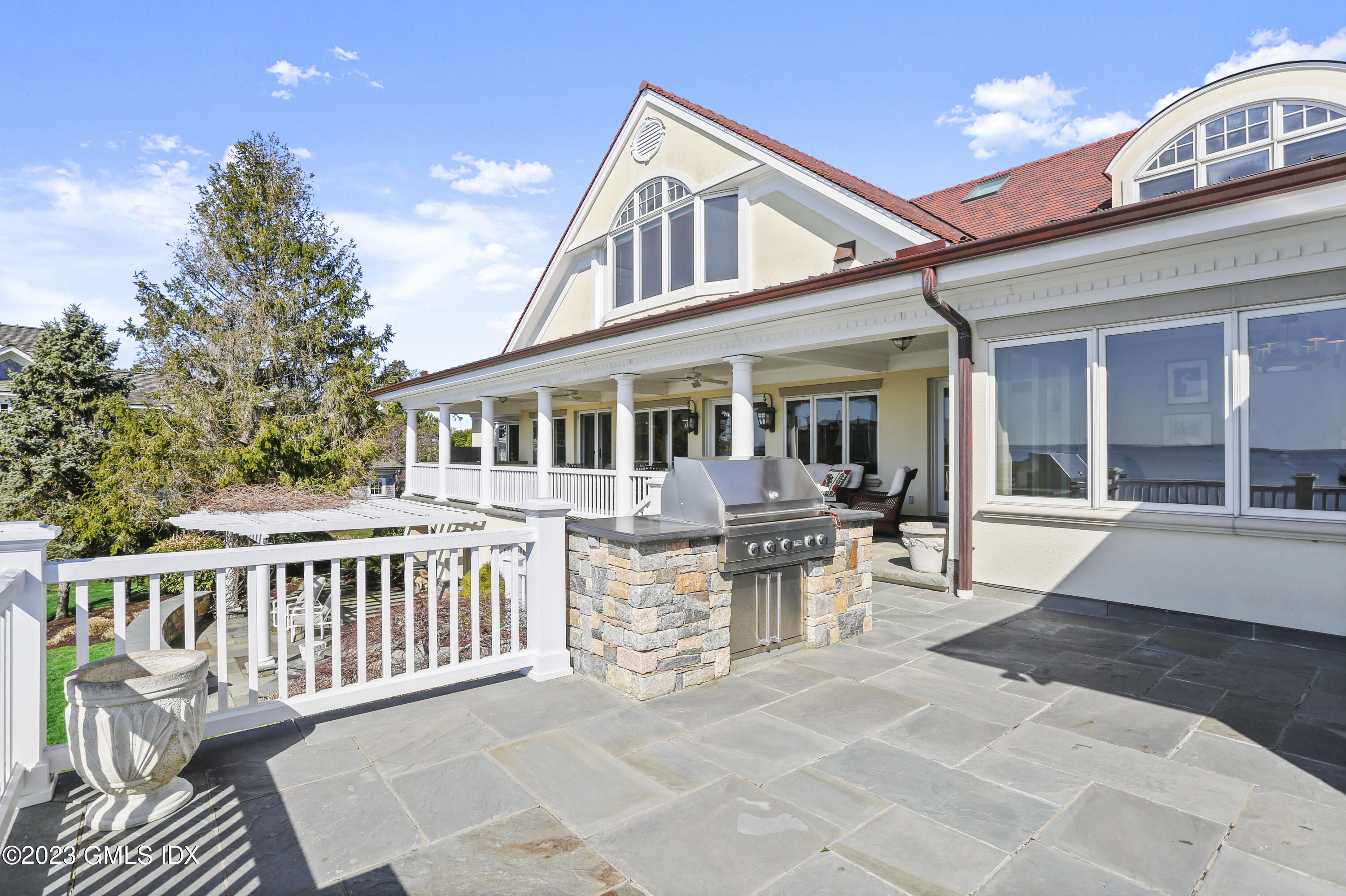 18 Pilot Rock Lane Riverside, CT 06878 - Photo 21 of 50 a view of a house with patio and deck