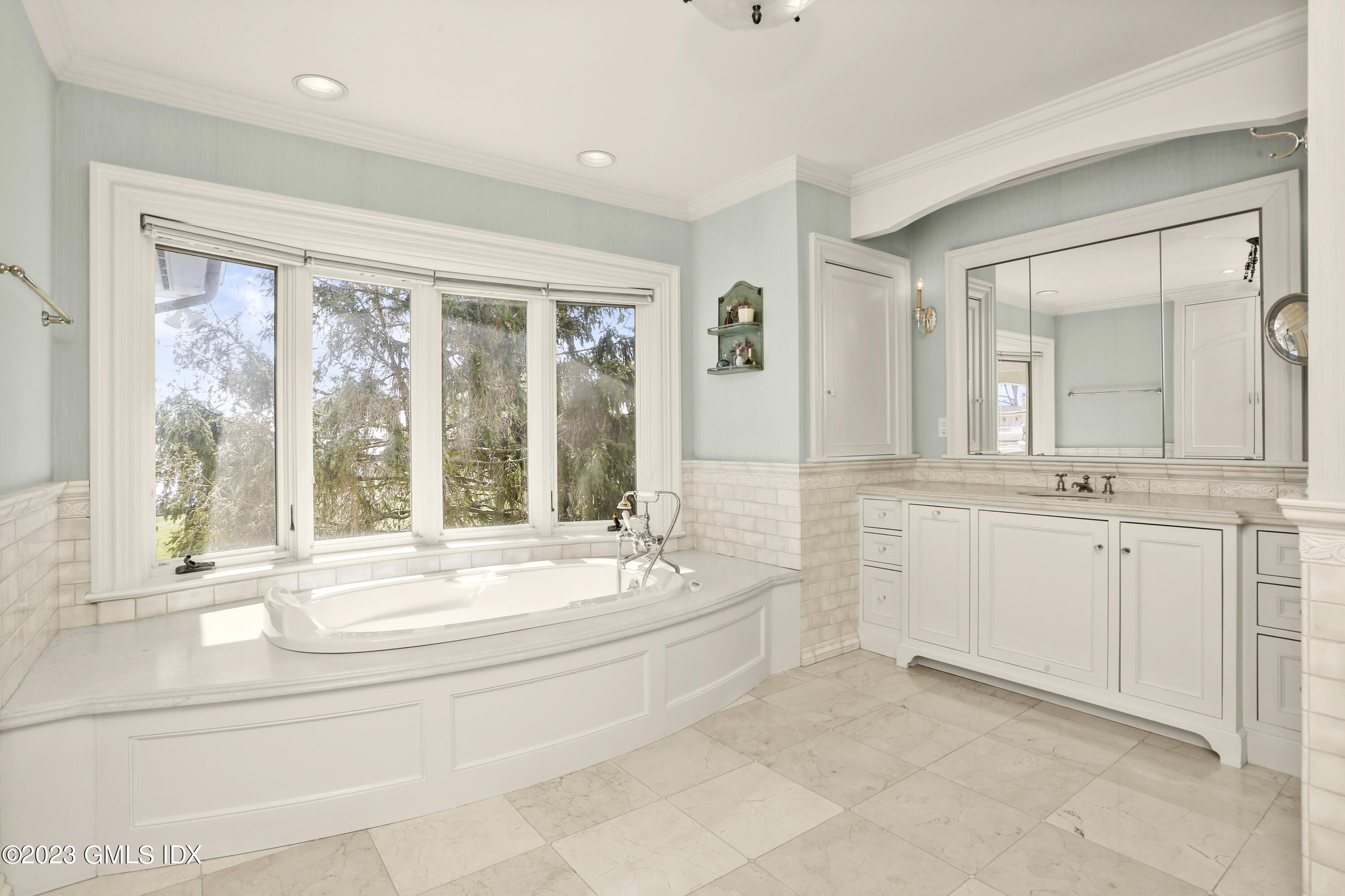 18 Pilot Rock Lane Riverside, CT 06878 - Photo 25 of 50 a bathroom with sink a bathtub and next to a window