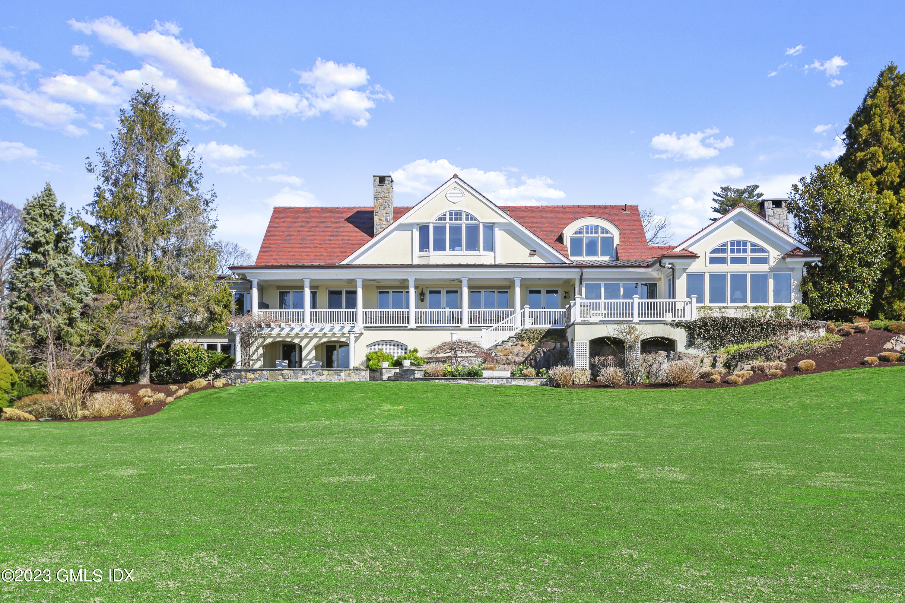 18 Pilot Rock Lane Riverside, CT 06878 - Photo 3 of 50 a front view of a residential houses with yard and green space