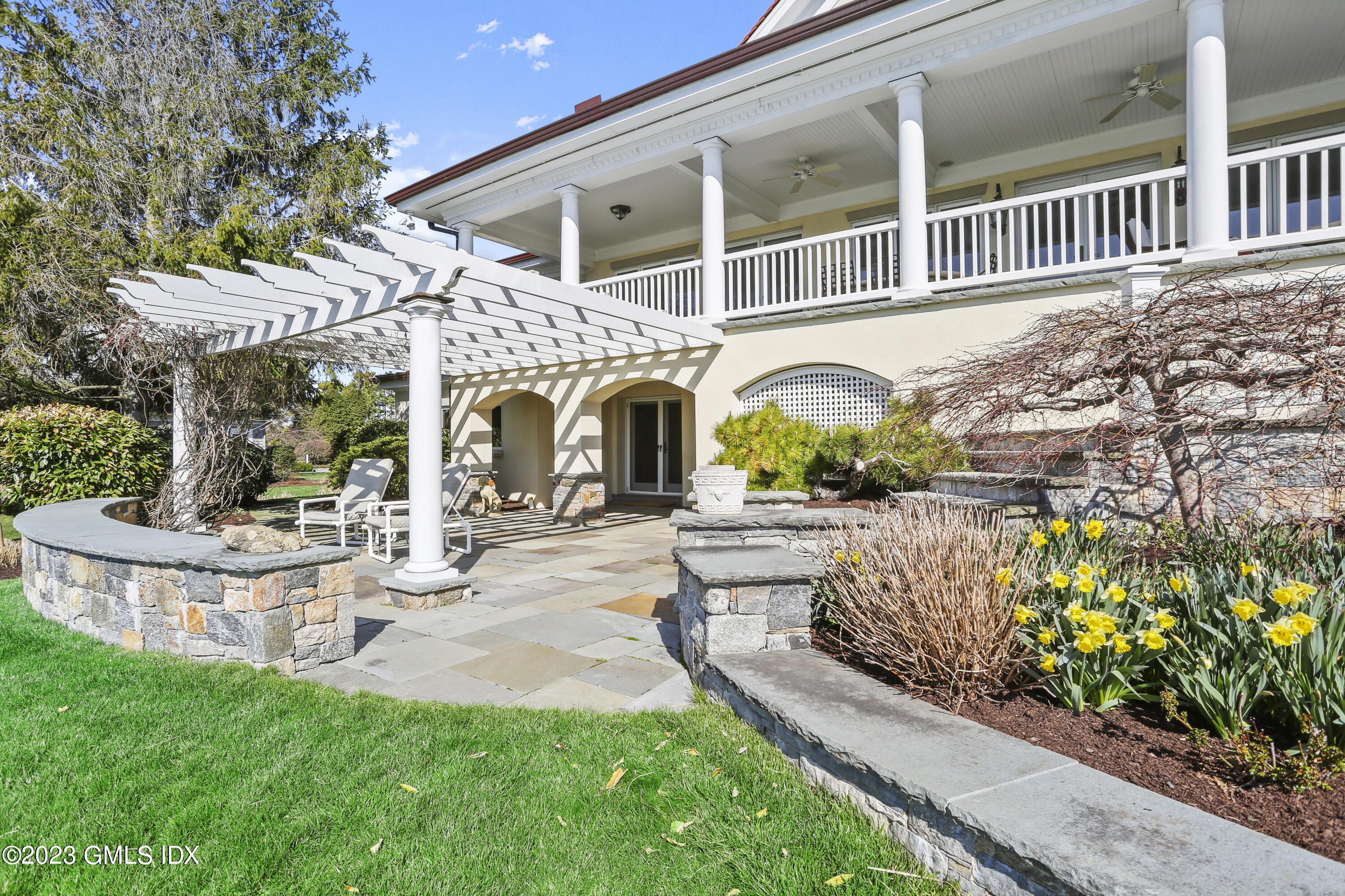 18 Pilot Rock Lane Riverside, CT 06878 - Photo 41 of 50 a front view of a house with garden and porch