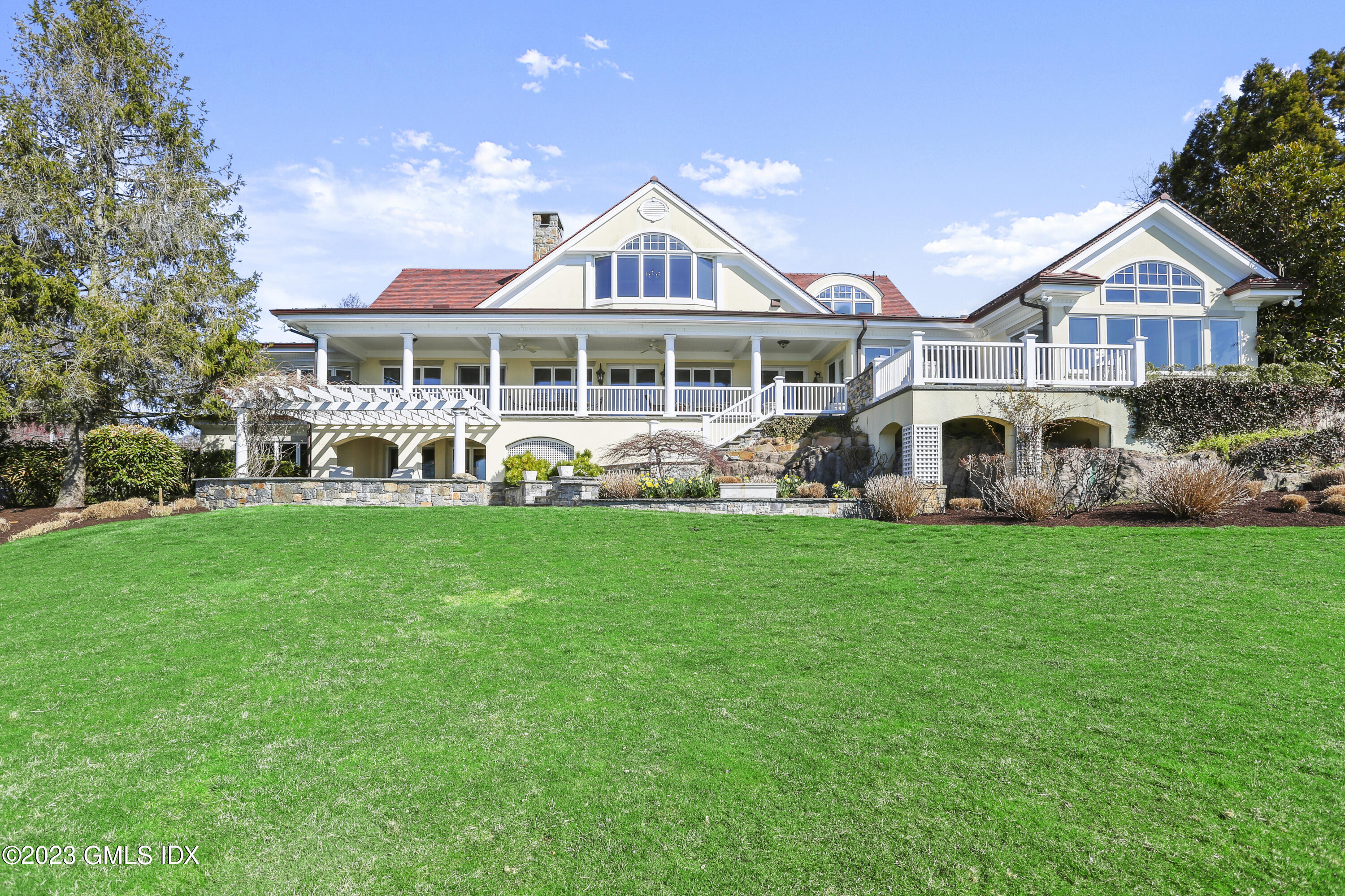 18 Pilot Rock Lane Riverside, CT 06878 - Photo 43 of 50 a front view of a house with garden