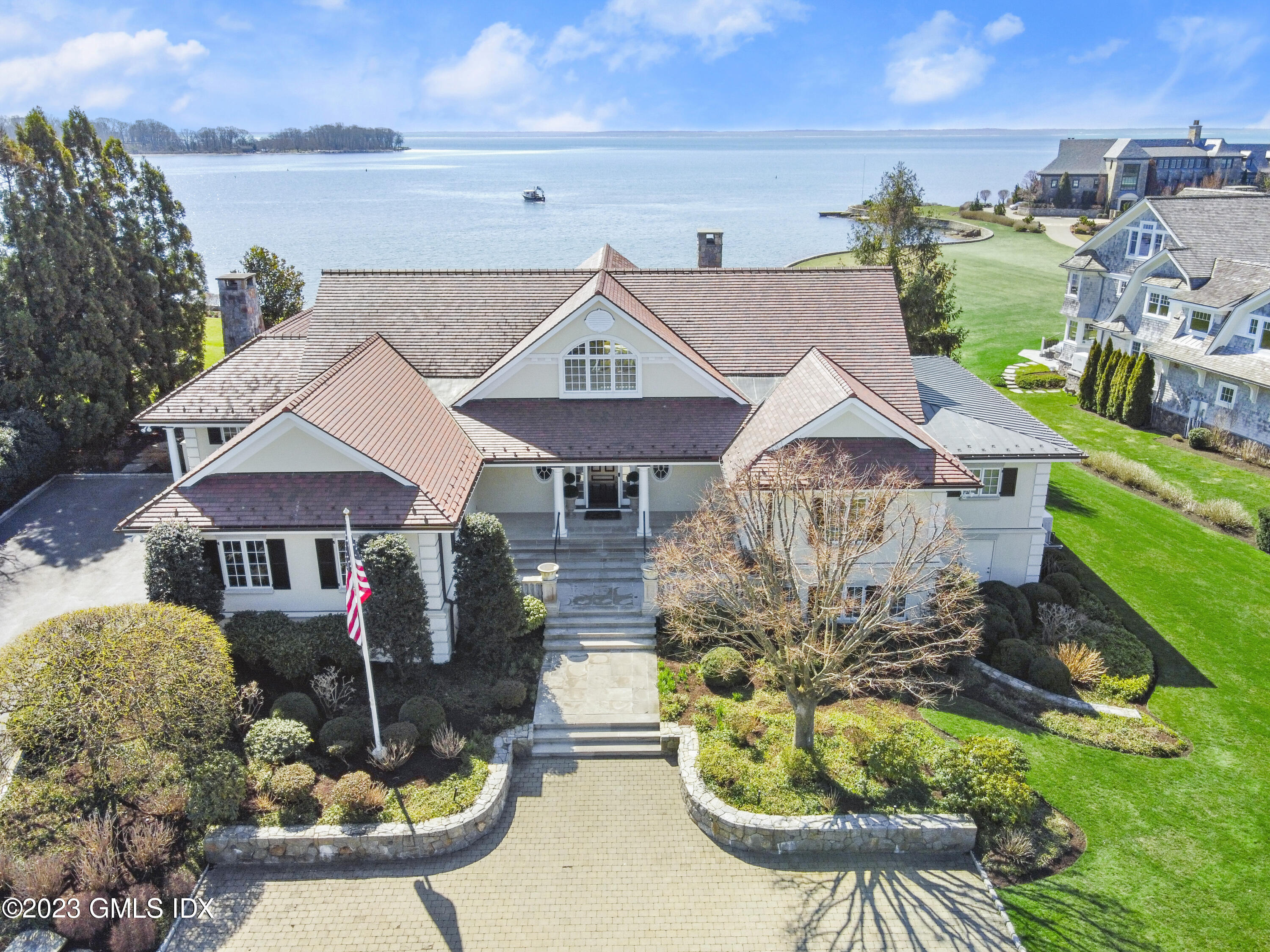 18 Pilot Rock Lane Riverside, CT 06878 - Photo 45 of 50 a front view of a house with yard porch and furniture