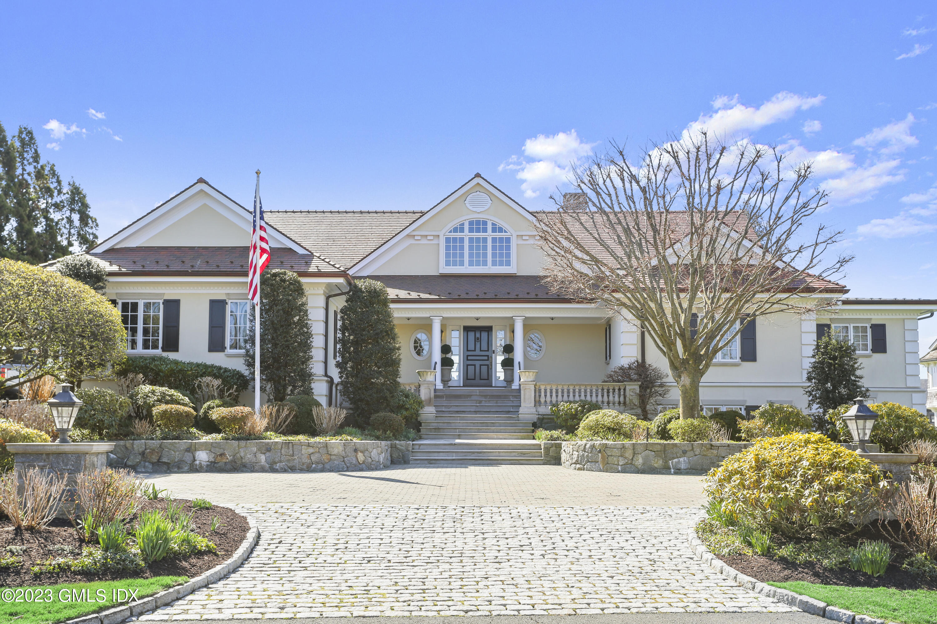 18 Pilot Rock Lane Riverside, CT 06878 - Photo 5 of 50 a front view of a house with garden