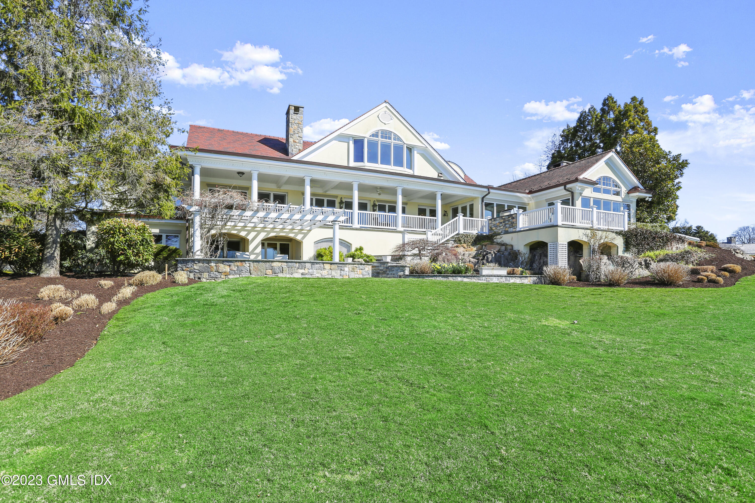 18 Pilot Rock Lane Riverside, CT 06878 - Photo 6 of 50 a front view of a house with garden