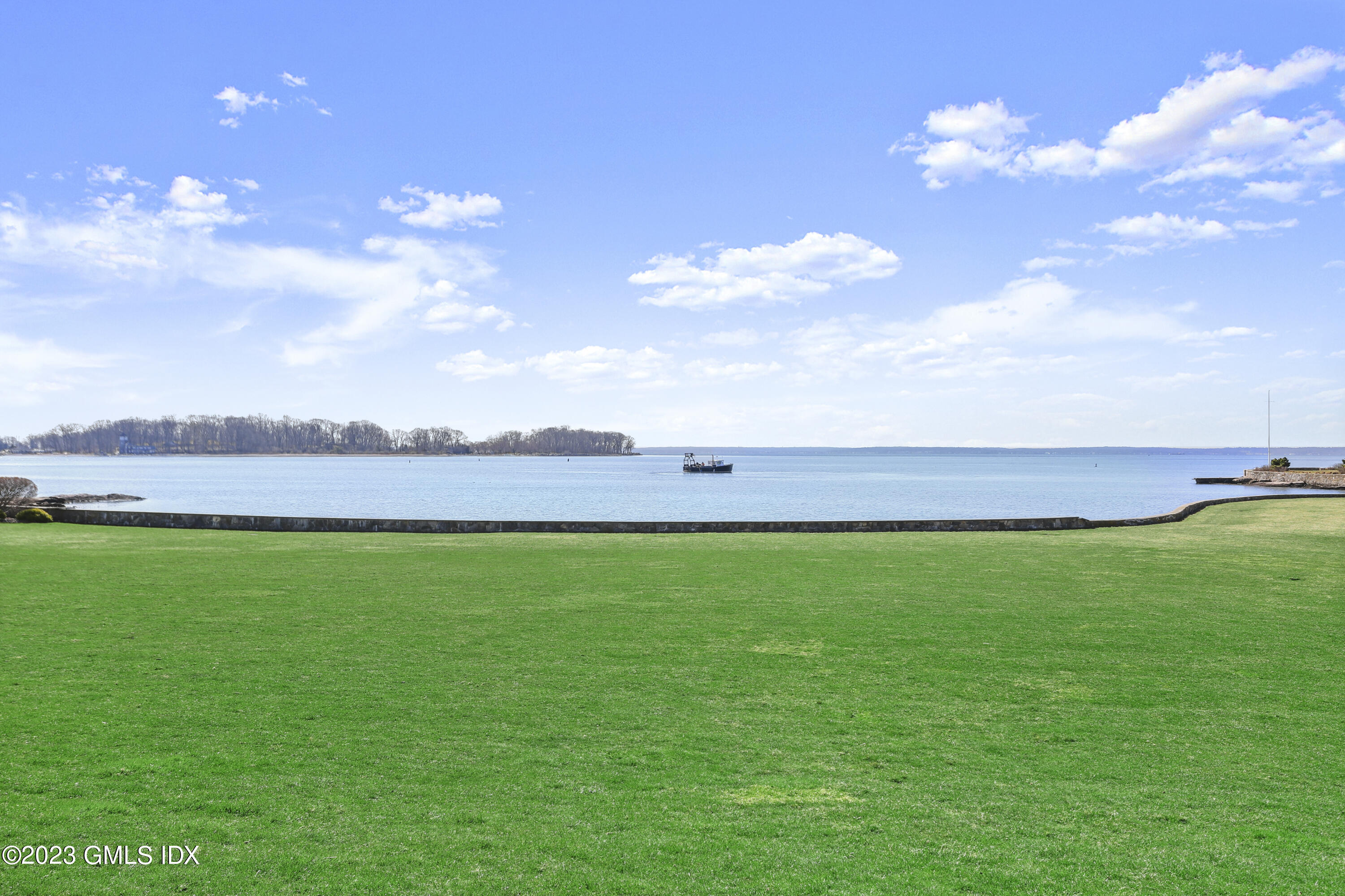 18 Pilot Rock Lane Riverside, CT 06878 - Photo 7 of 50 a view of a big yard with swimming pool and outdoor seating