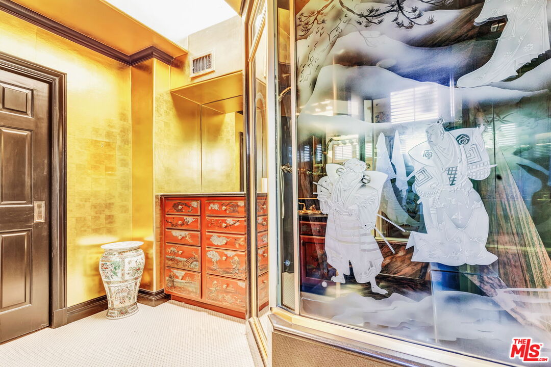 527 North Maple Drive Beverly Hills, CA 90210 - Photo 32 of 54 a view of a living room and bathroom