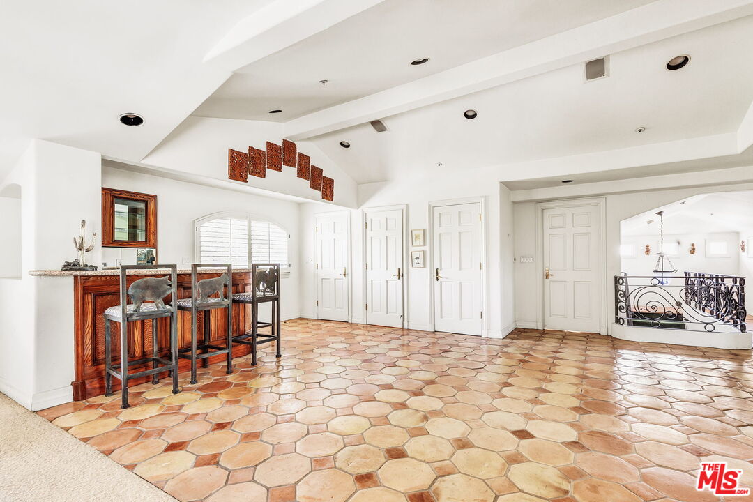 527 North Maple Drive Beverly Hills, CA 90210 - Photo 38 of 54 a view of a livingroom with furniture and window