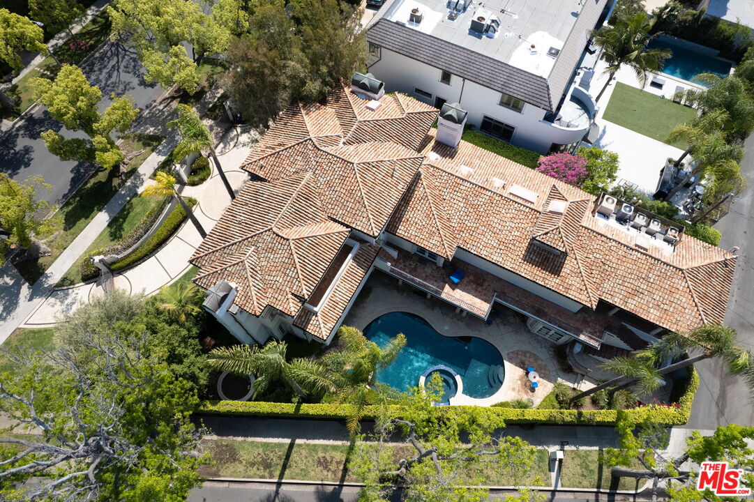 527 North Maple Drive Beverly Hills, CA 90210 - Photo 52 of 54 an aerial view of a house with a yard and potted plants