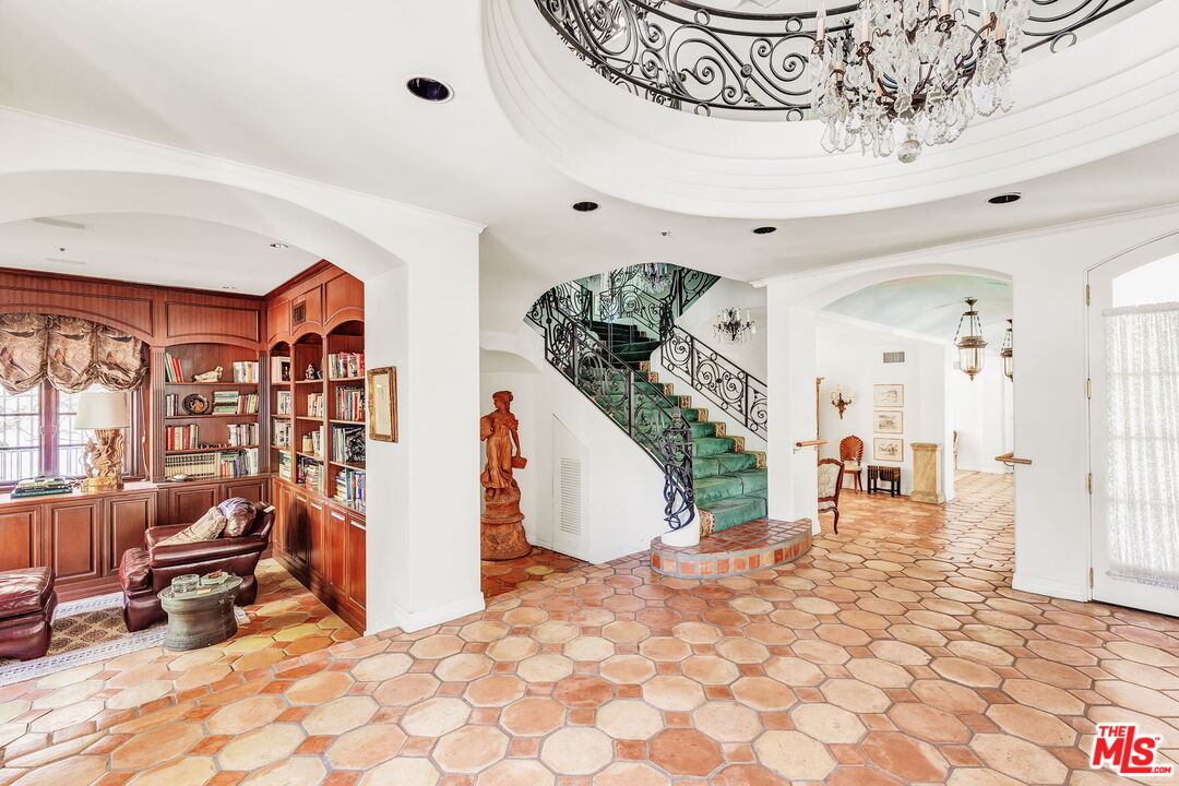 527 North Maple Drive Beverly Hills, CA 90210 - Photo 8 of 54 a view of a livingroom with furniture and a rug