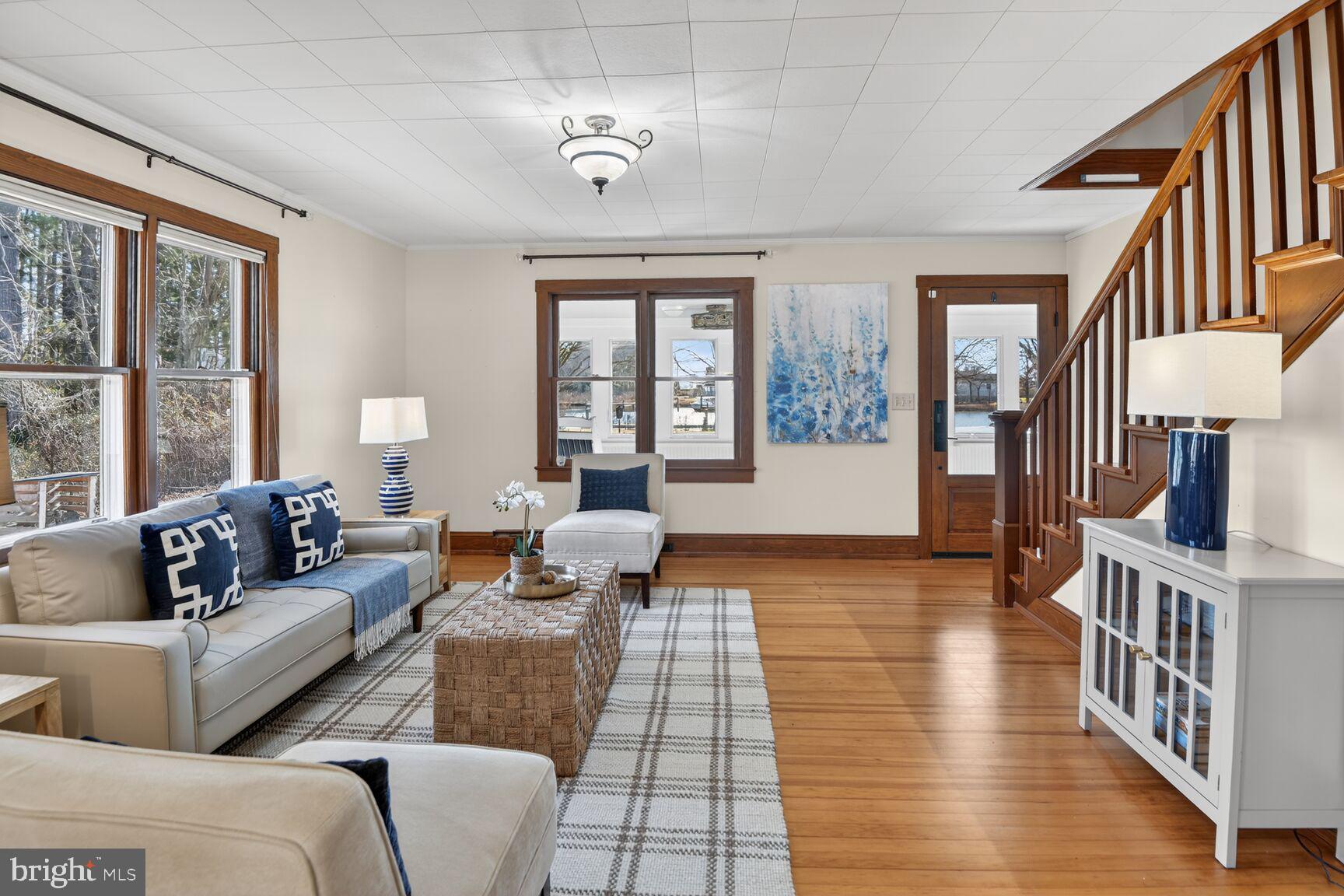 22769 Almost Neavitt Road Bozman, MD 21612 - Photo 20 of 44 a living room with furniture and wooden floor