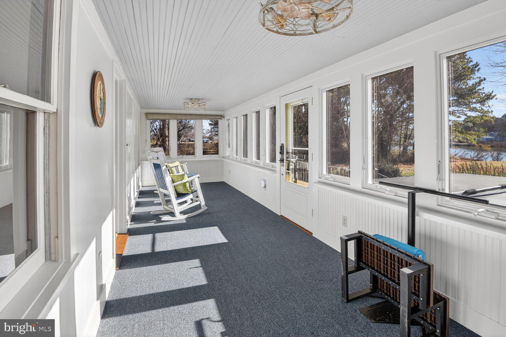 22769 Almost Neavitt Road Bozman, MD 21612 - Photo 26 of 44 a living room with furniture and a large window