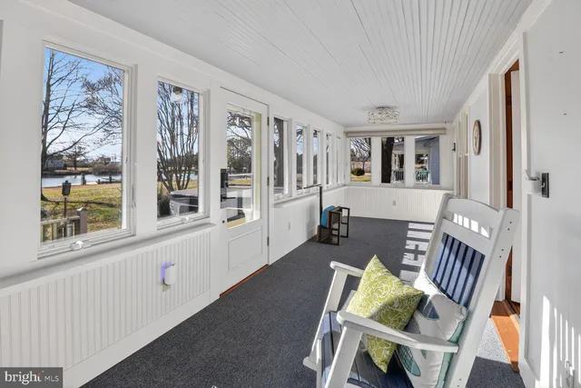 a bathroom with a granite countertop toilet a sink and a mirror