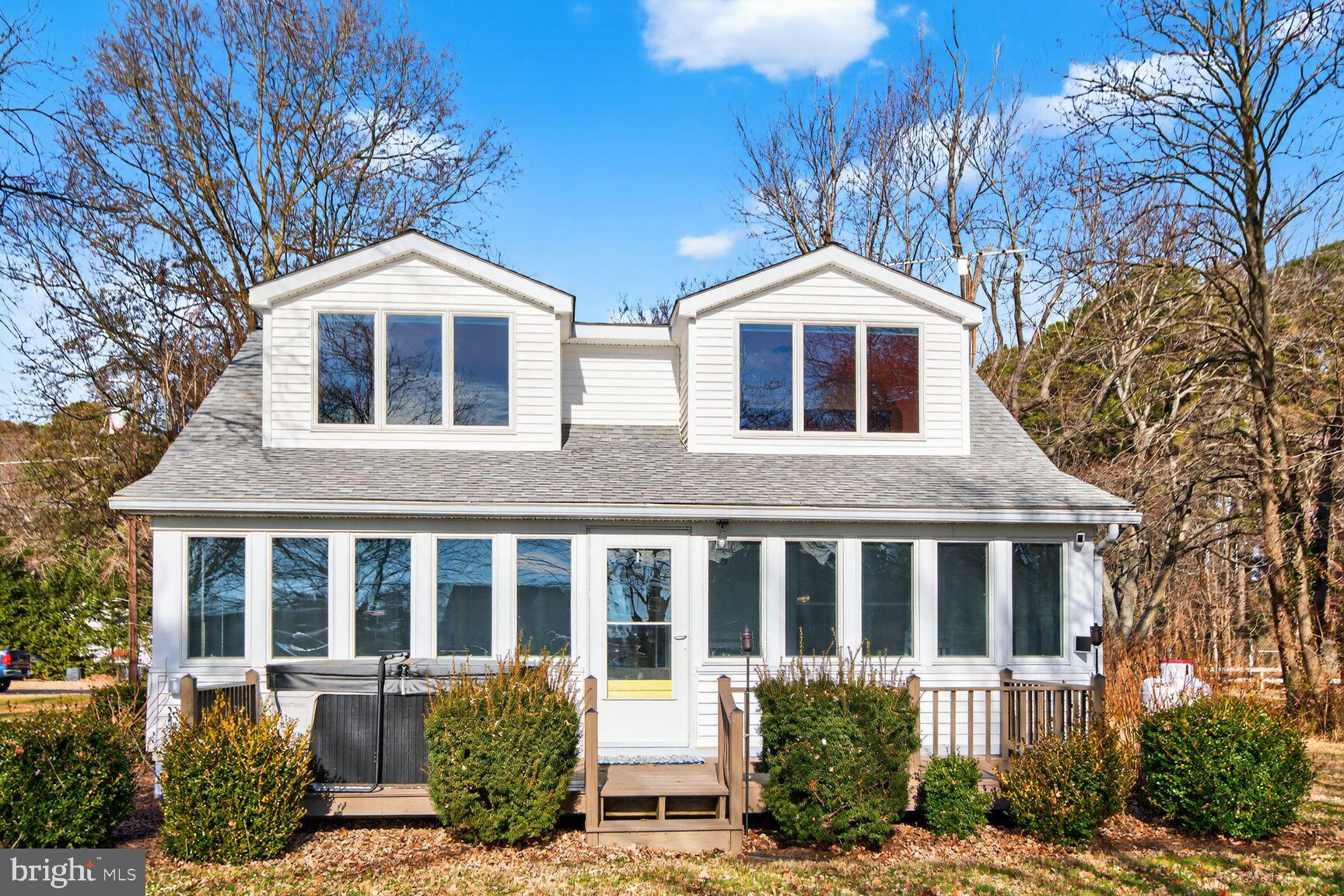 22769 Almost Neavitt Road Bozman, MD 21612 - Photo 37 of 44 a front view of a house with a yard