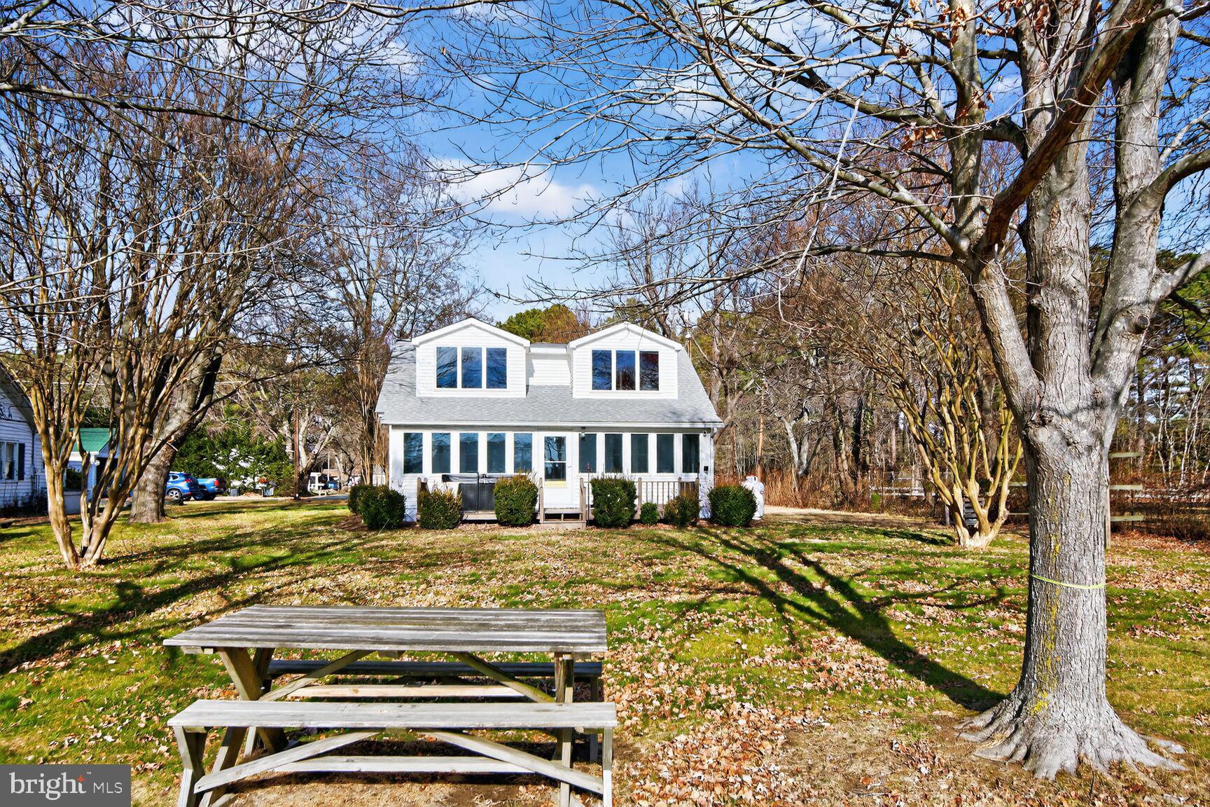 22769 Almost Neavitt Road Bozman, MD 21612 - Photo 39 of 44 a front view of a house with a yard