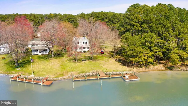 a view of a terrace with wooden floor and lake view