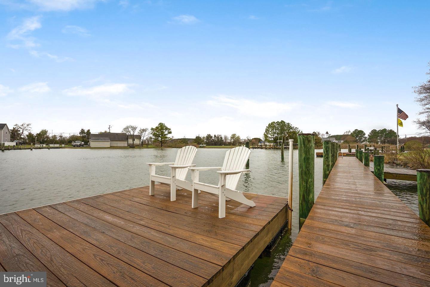22769 Almost Neavitt Road Bozman, MD 21612 - Photo 7 of 44 a view of a terrace with wooden floor and lake view