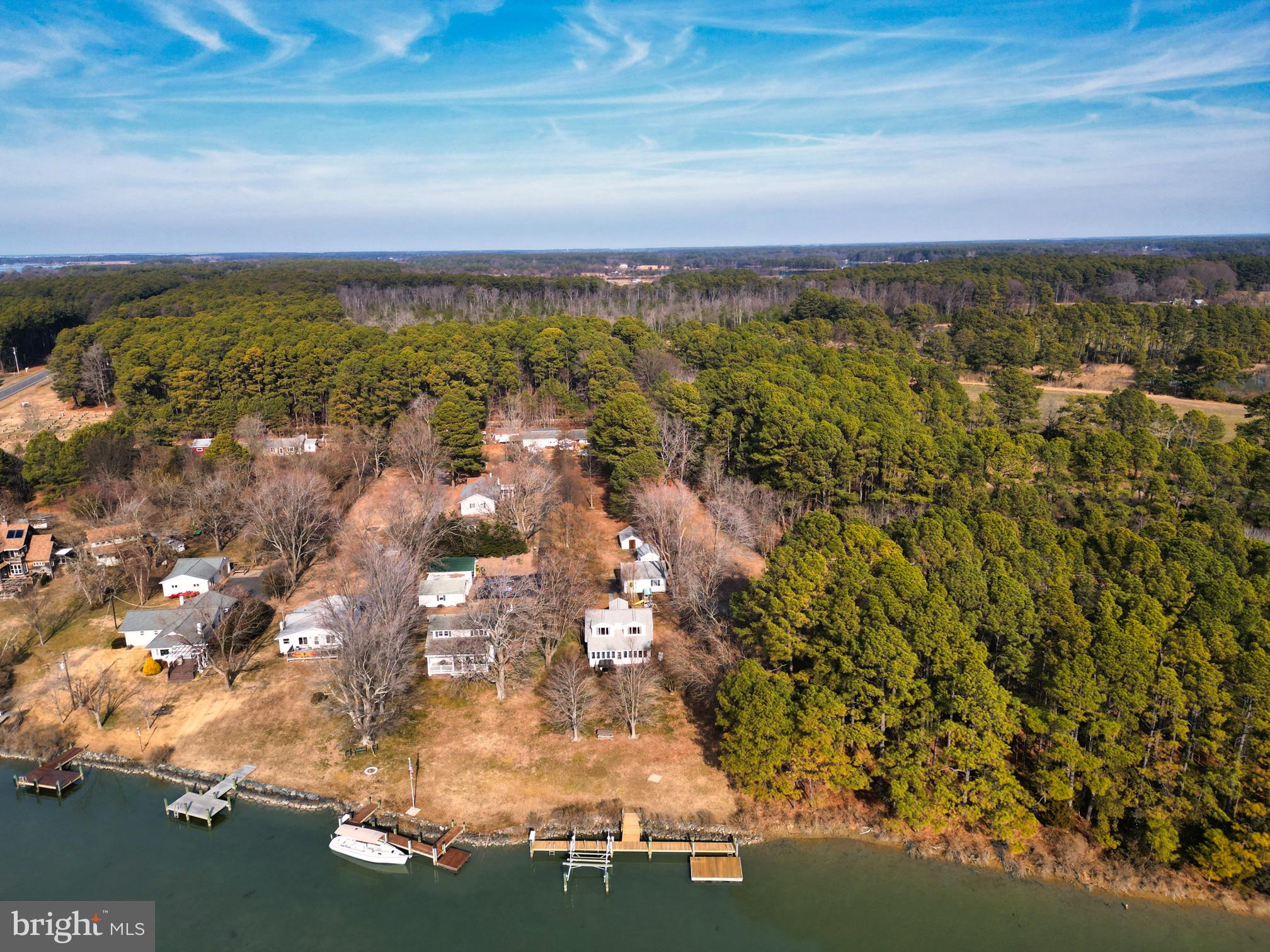 22769 Almost Neavitt Road Bozman, MD 21612 - Photo 9 of 44 an aerial view of residential building and trees around