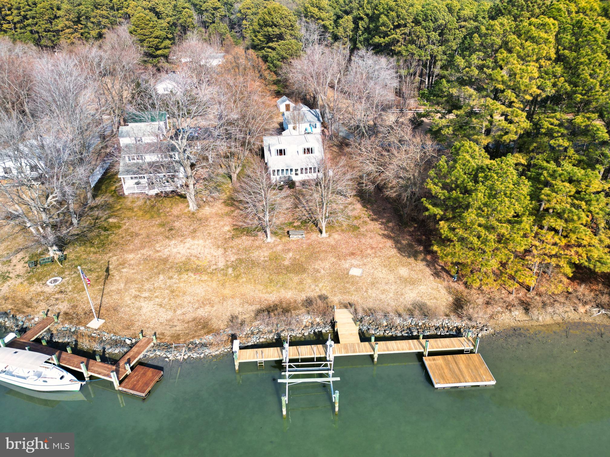 22769 Almost Neavitt Road Bozman, MD 21612 - Photo 10 of 44 an aerial view of a house with a yard wooden table and chairs