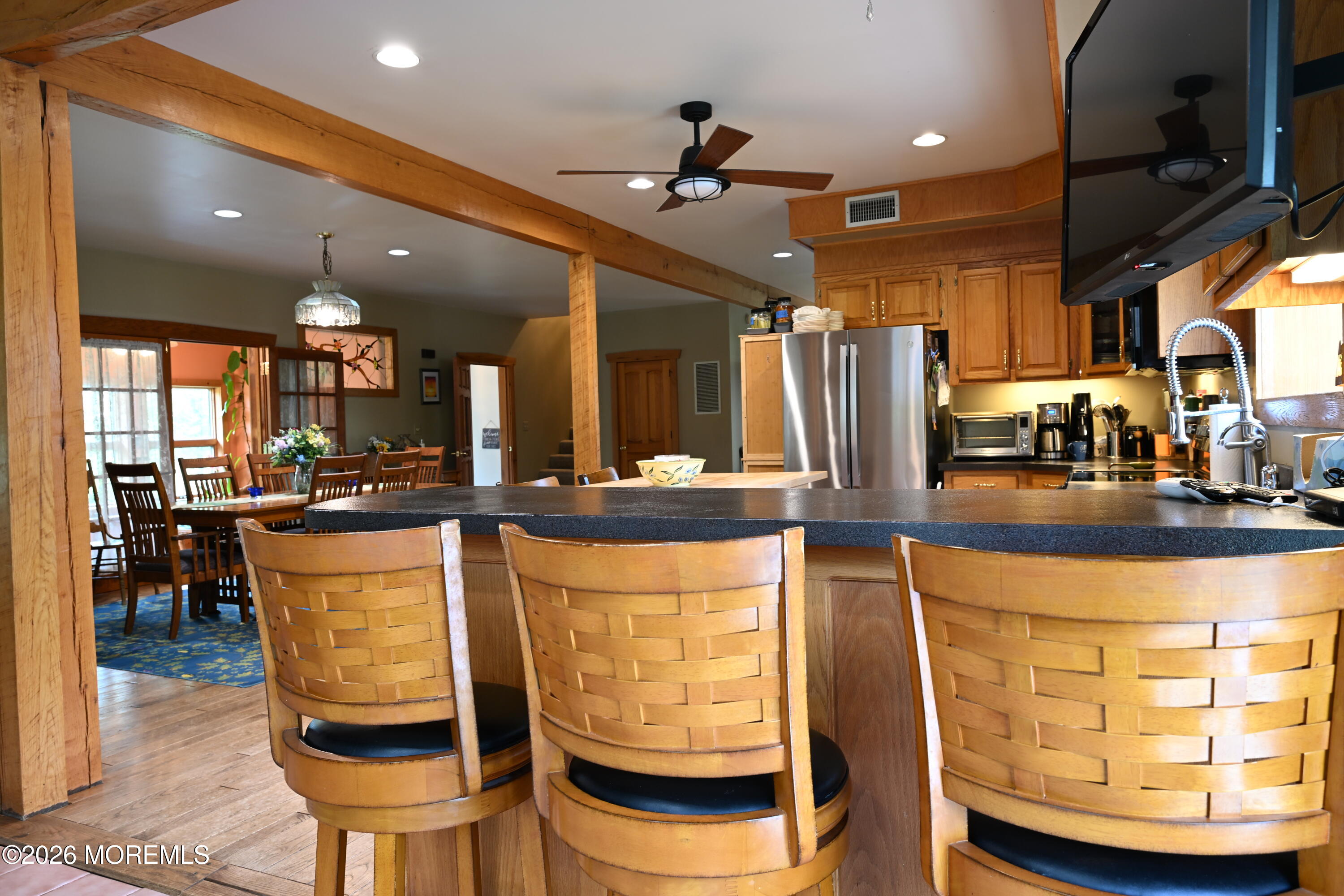 20 Hluchy Road Robbinsville, NJ 08691 - Photo 11 of 38 a view of a kitchen with kitchen island dining table and stainless steel appliances