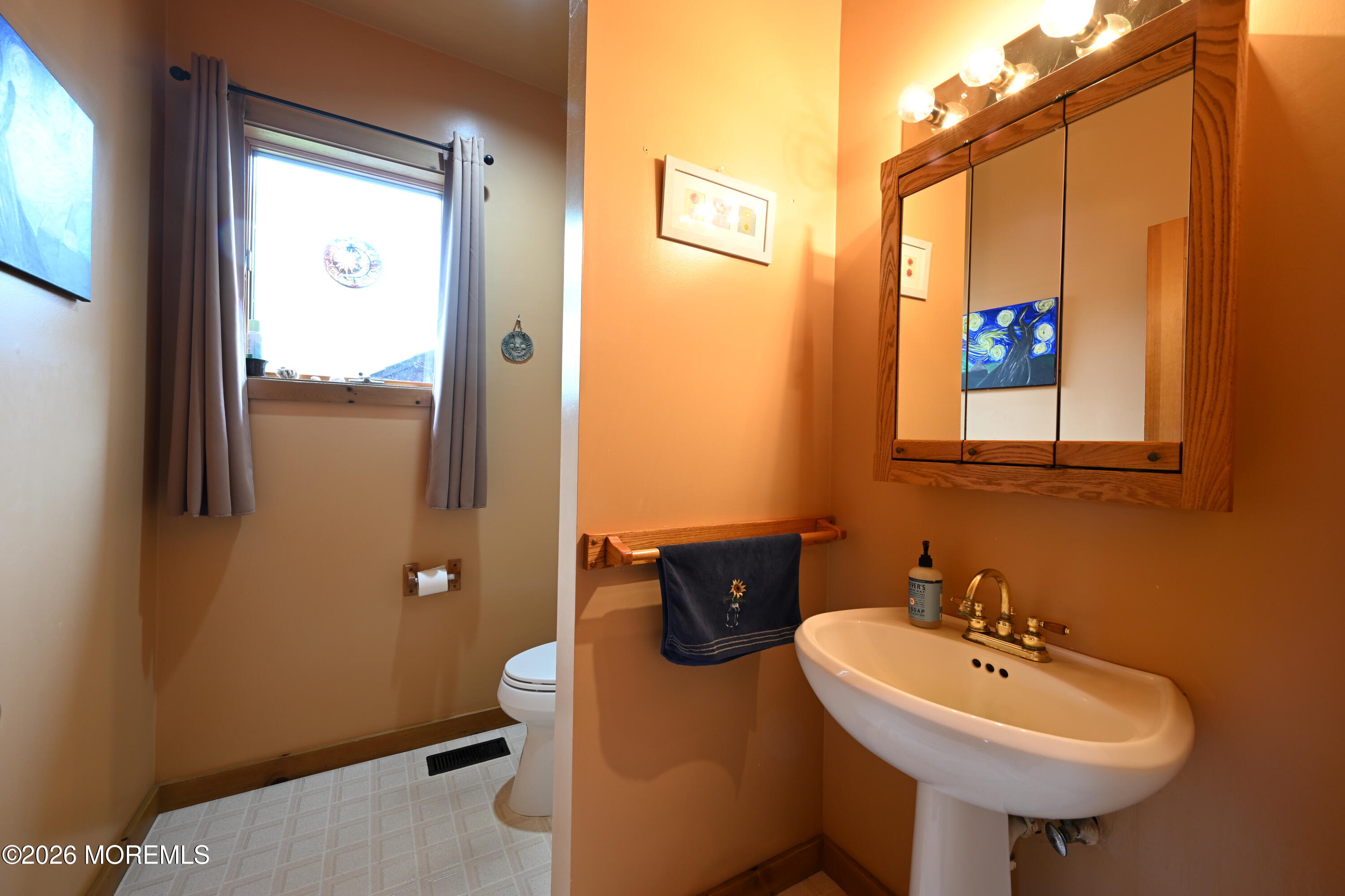 20 Hluchy Road Robbinsville, NJ 08691 - Photo 17 of 38 a bathroom with a sink toilet and mirror