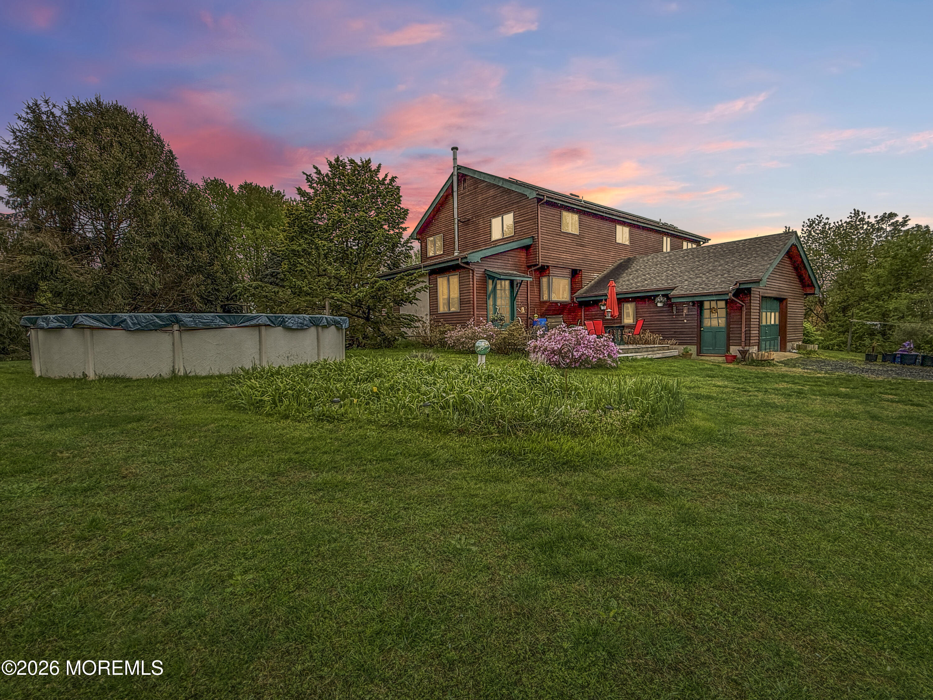 20 Hluchy Road Robbinsville, NJ 08691 - Photo 2 of 38 a backyard of a house with table and chairs