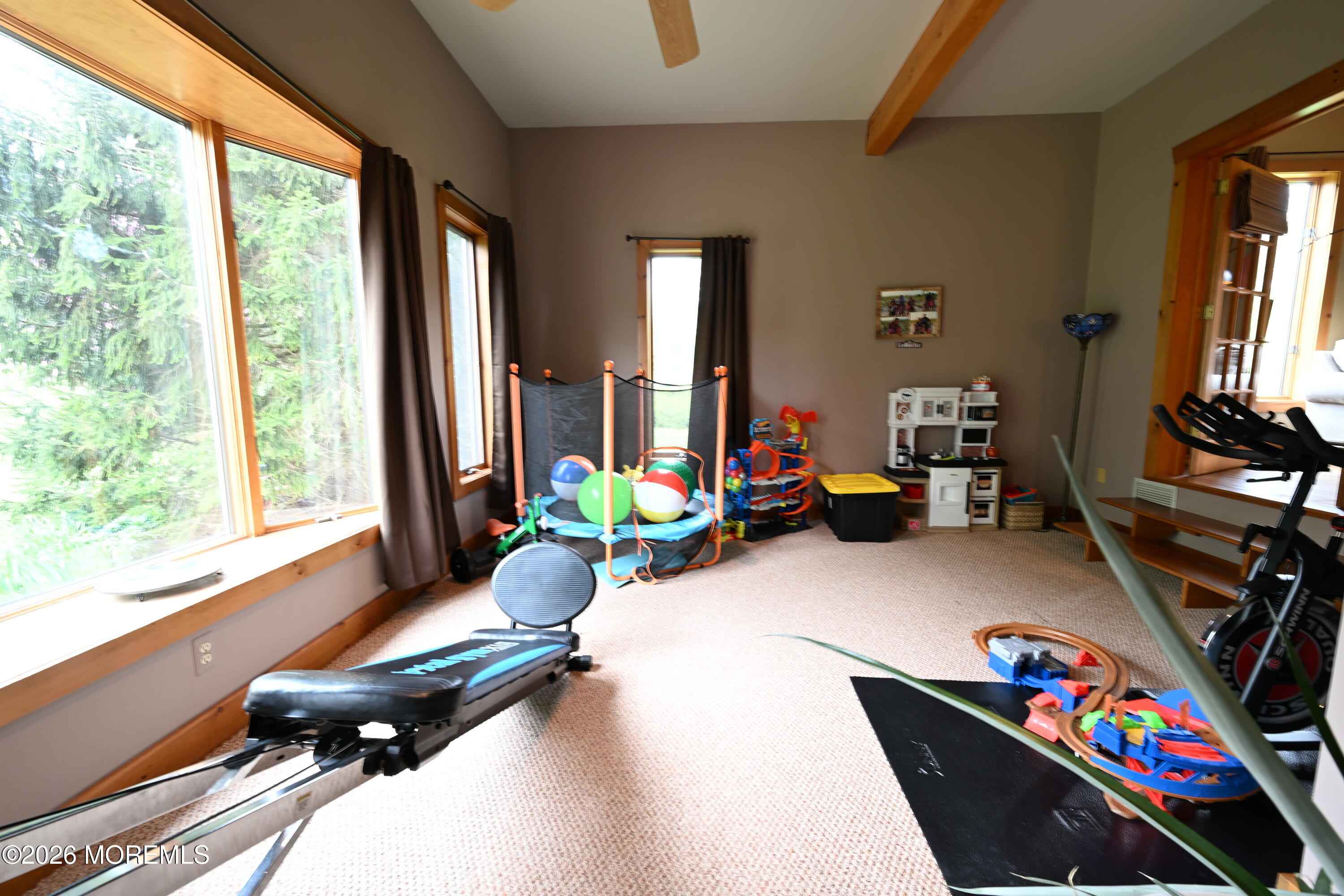 20 Hluchy Road Robbinsville, NJ 08691 - Photo 22 of 38 a living room with furniture a flat screen tv and a window