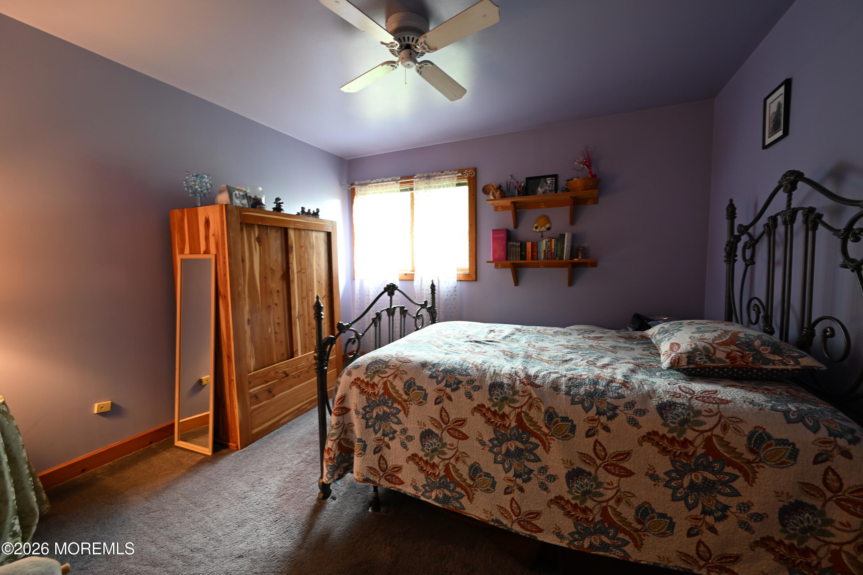 20 Hluchy Road Robbinsville, NJ 08691 - Photo 32 of 38 a bedroom with a bed and a chandelier