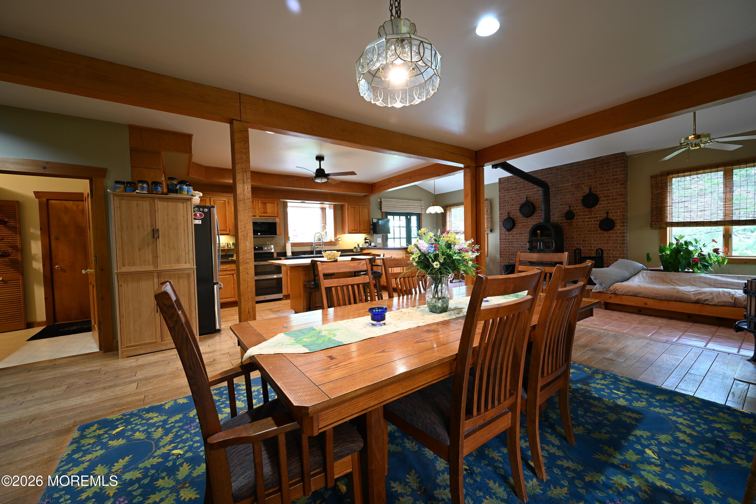 20 Hluchy Road Robbinsville, NJ 08691 - Photo 4 of 38 a view of a dining room with furniture a chandelier and wooden floor