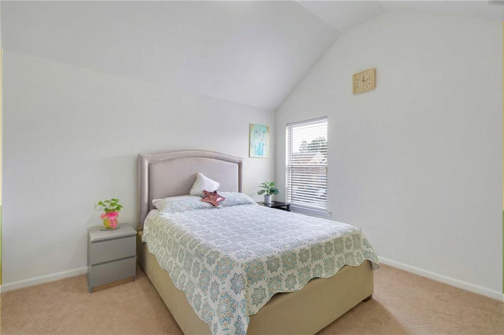 2325 Arnold Mill Road Northwest Lawrenceville, GA 30044 - Photo 21 of 40 a bedroom with a bed and a window