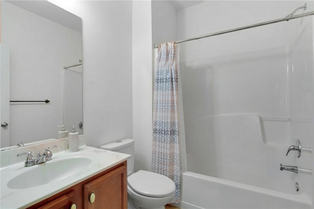 2325 Arnold Mill Road Northwest Lawrenceville, GA 30044 - Photo 25 of 40 a bathroom with a sink a toilet and shower