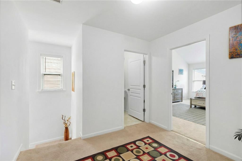 2325 Arnold Mill Road Northwest Lawrenceville, GA 30044 - Photo 26 of 40 a view of a hallway with bathroom and wooden floor