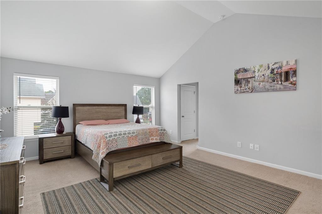 2325 Arnold Mill Road Northwest Lawrenceville, GA 30044 - Photo 30 of 40 a bedroom with a bed and wooden floor