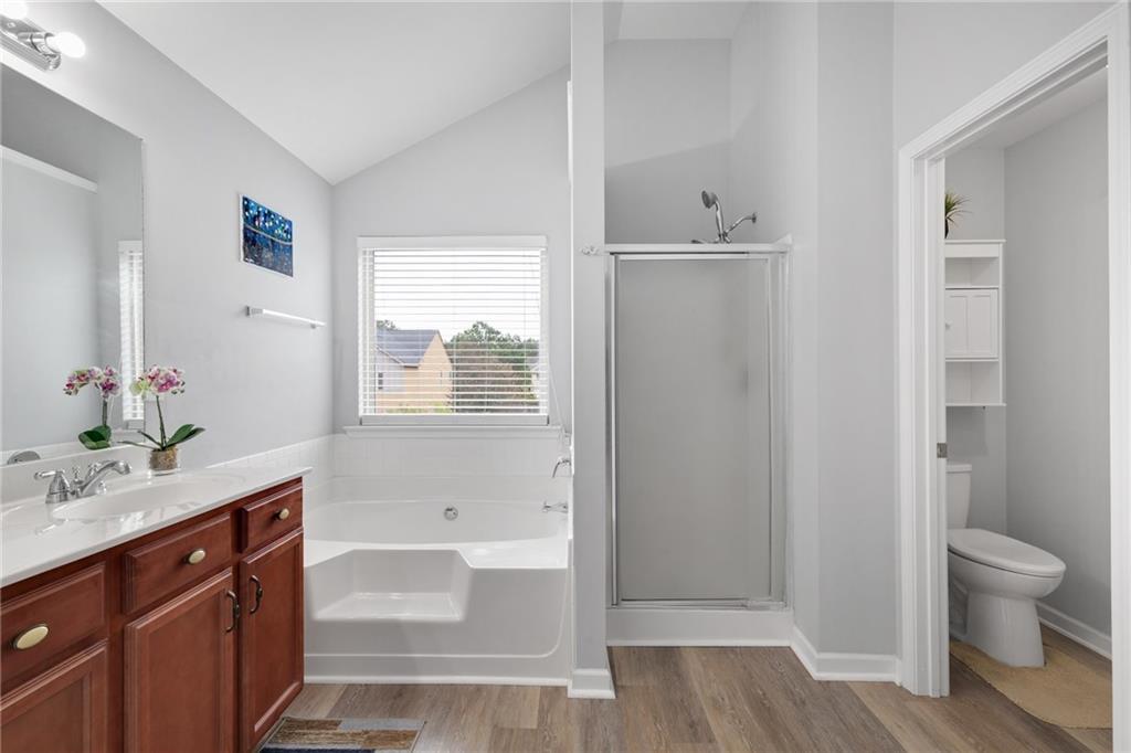 2325 Arnold Mill Road Northwest Lawrenceville, GA 30044 - Photo 31 of 40 a bathroom with a sink a toilet and shower