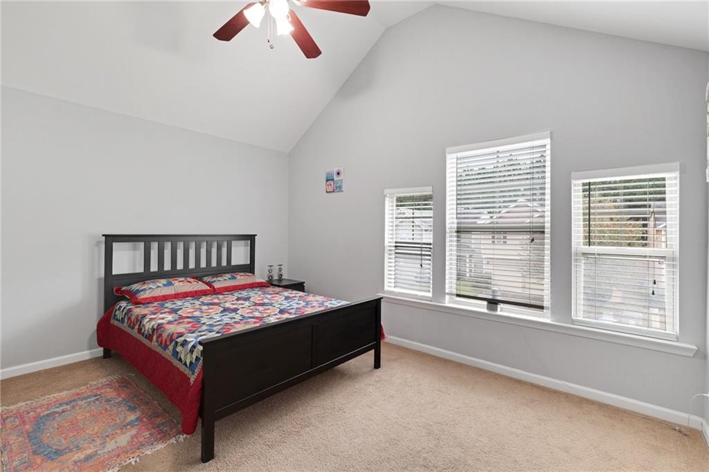 2325 Arnold Mill Road Northwest Lawrenceville, GA 30044 - Photo 34 of 40 a bedroom with a bed and a large window