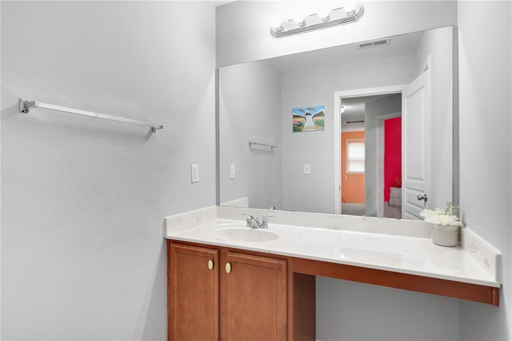 2325 Arnold Mill Road Northwest Lawrenceville, GA 30044 - Photo 36 of 40 a bathroom with a sink and a mirror