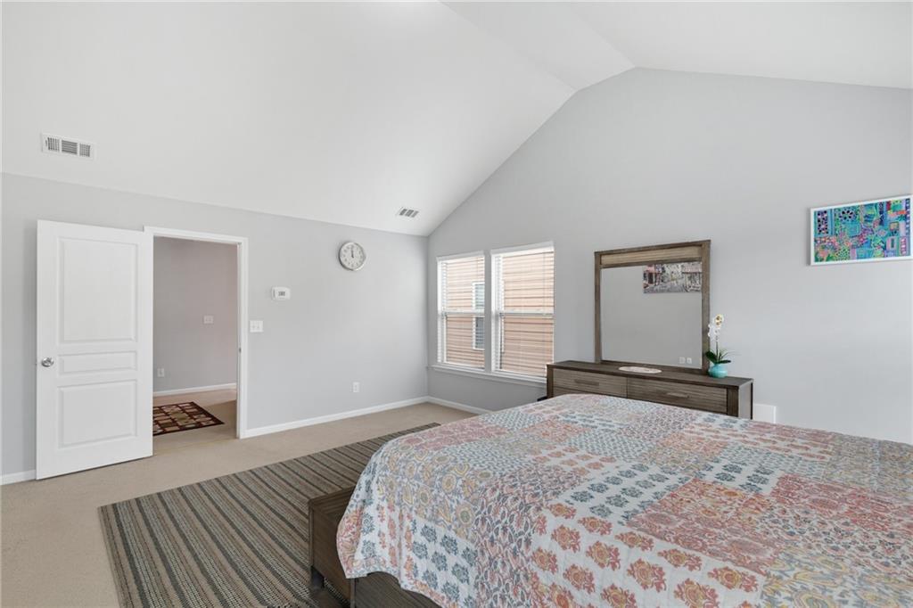 2325 Arnold Mill Road Northwest Lawrenceville, GA 30044 - Photo 38 of 40 a bedroom with a bed and wooden floor