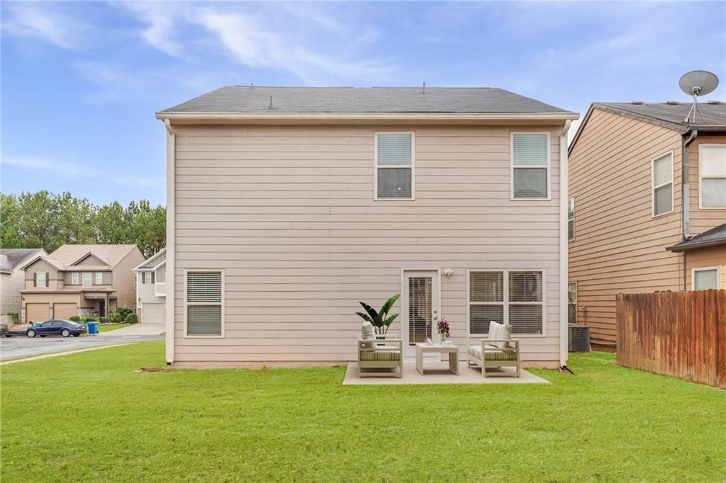2325 Arnold Mill Road Northwest Lawrenceville, GA 30044 - Photo 39 of 40 a view of a house with a yard and sitting area